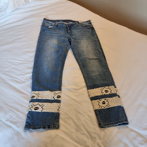 Upcycled jeans with bogolan.